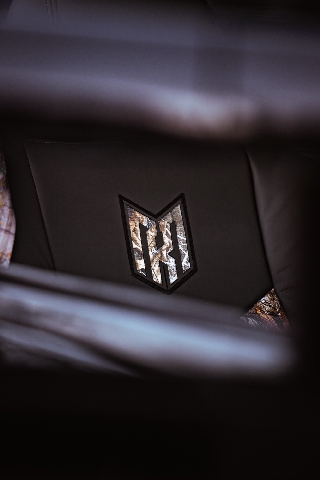 MH Camo Crest Tee — chest crest close-up